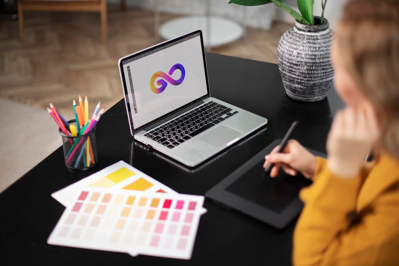 female-logo-designer-working-her-tablet-connected-laptop_23-2149119262